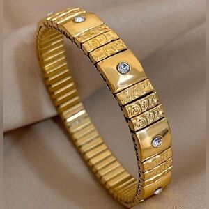 Gold Tone Stretchy Rhinestone Bracelet.