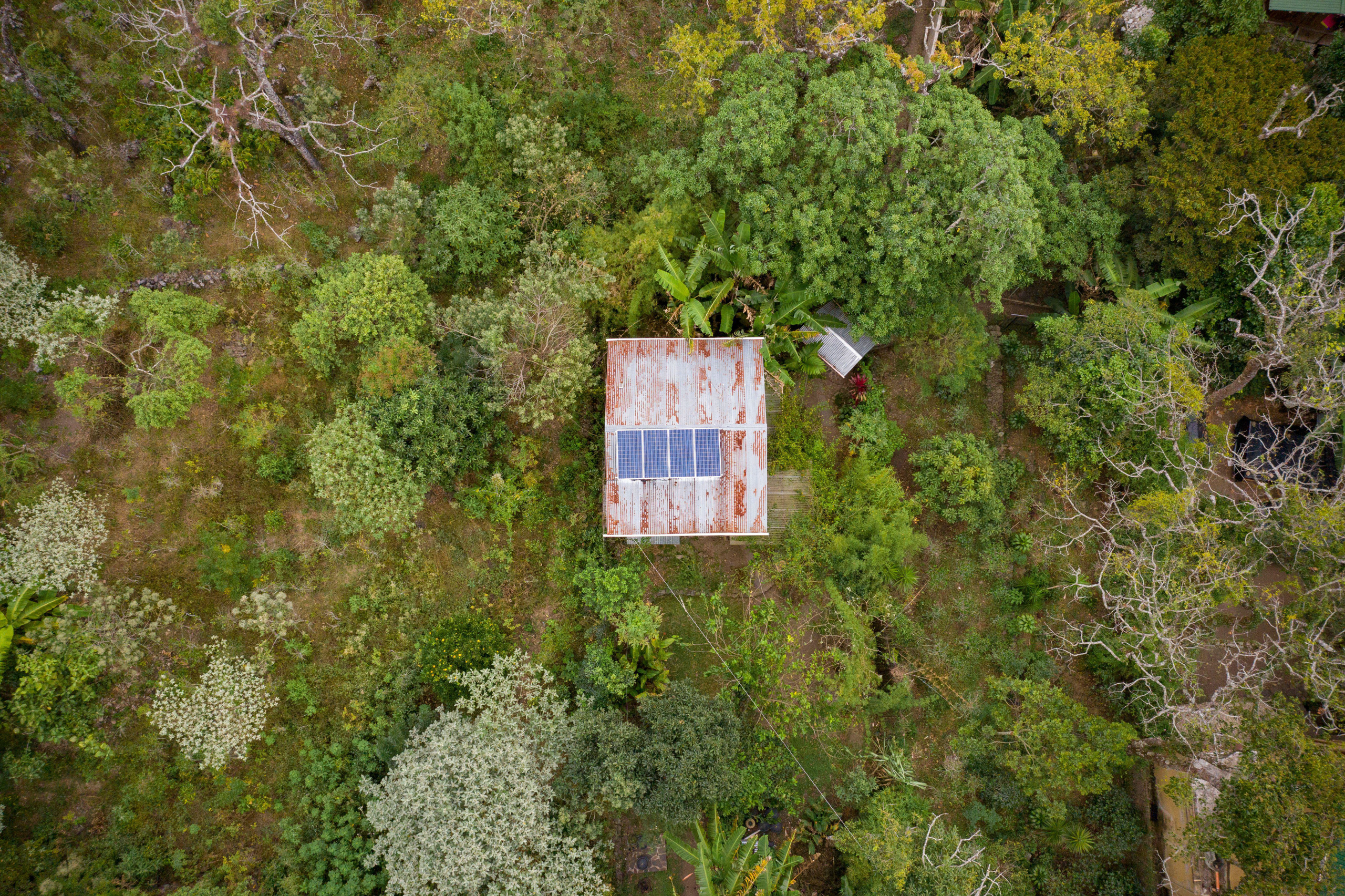 <p>Rooftop solar panels in San Marcos La Laguna, Guatemala. Last year, the Caribbean country reportedly allocated 35 times more resources towards activities that will combat climate change than it did to carbon-intensive activities (Image: Jake Lyell / Alamy)</p>