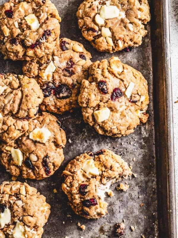 A baking sheet with macadamia nut cookies arranged on it.