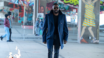 Colman Domingo as Muncie Daniels walks through an underpass covered in graffiti in 'The Madness.'