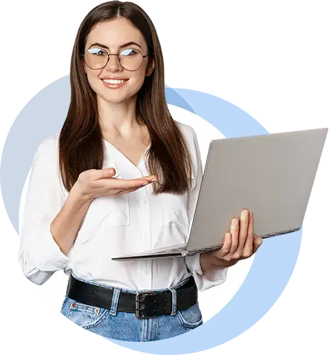 Professional woman standing and smiling, holding a laptop