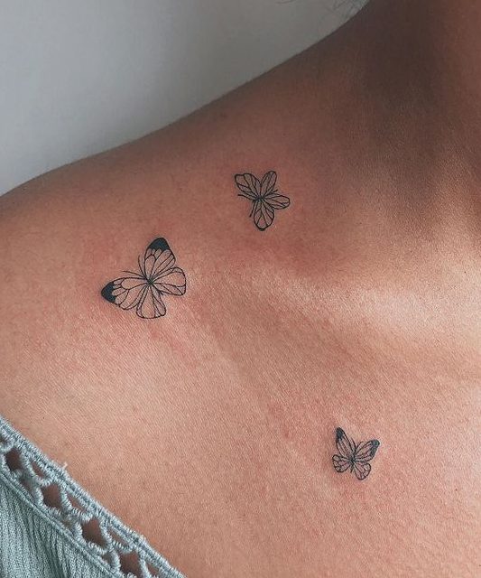 butterfly tattoo on woman's chest