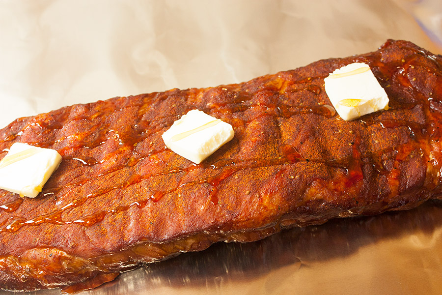 St Louis Style Ribs topped with butter and honey.