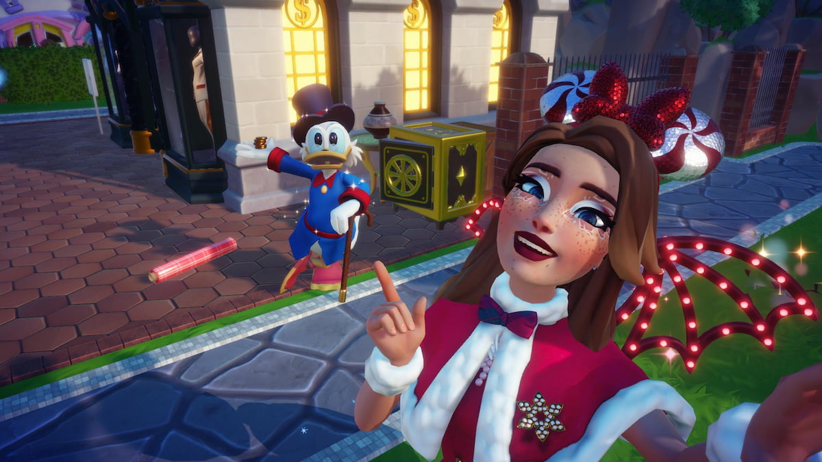 The player taking a selfie and pointing at some Festive Wrapping Paper on the ground by Scrooge n front of his shop in Disney Dreamlight Valley.