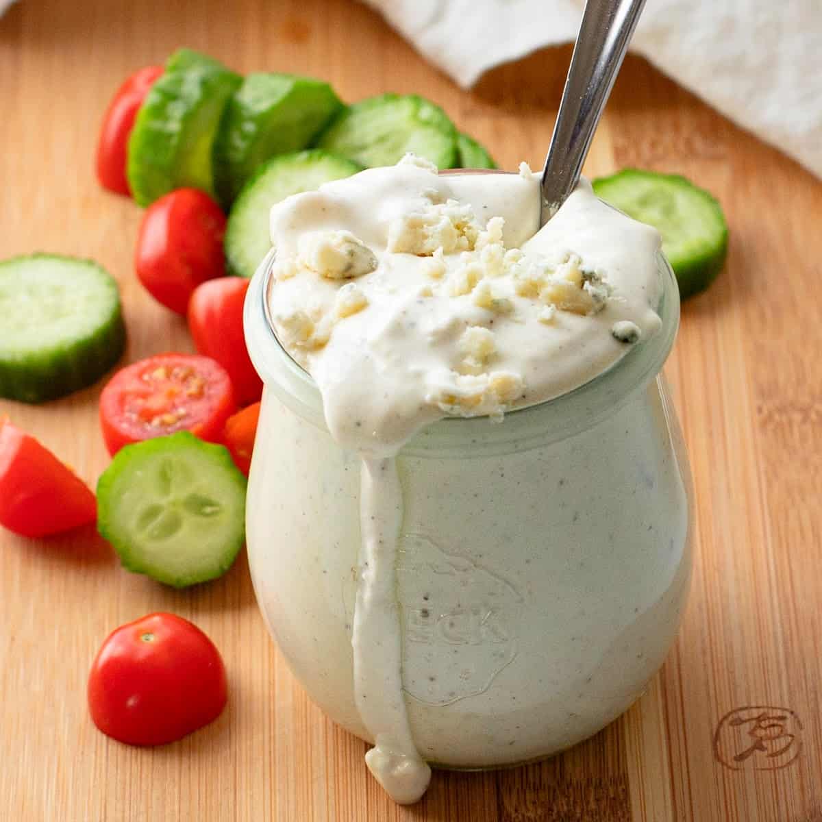 close-up of homemade blue cheese dressing in a glass jar