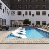 a swimming pool in front of a building