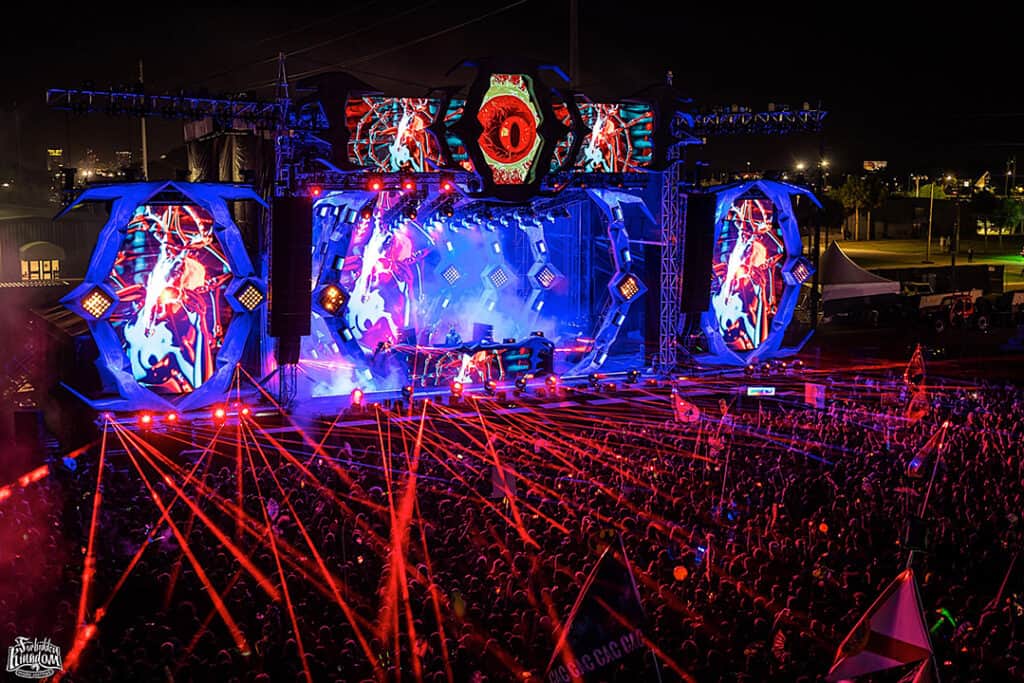 A crowd of people at an event with lights.