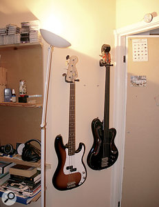 Eno's studio is still home to a few traditional instruments, like these basses.