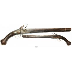 European flintlock pistol, 1700s, ornately carved stock.