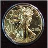 Image 1 : 979. 2005 American Eagle Silver Dollar. Gold Plated BU.