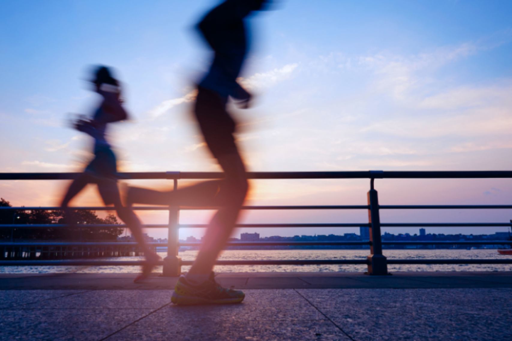 Two People Captured Jogging in Motion