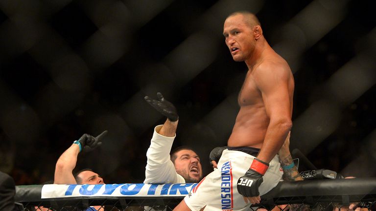 Dan Henderson climbs the cage after winning his middleweight bout at UFC 199 at The Forum on June 4, 2016 in Inglewood, California