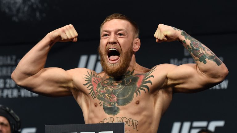 LAS VEGAS, NV - AUGUST 19:  UFC featherweight champion Conor McGregor poses on the scale during his weigh-in for UFC 202 at MGM Grand Conference Center on 