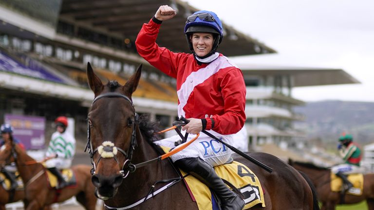 Rachael Blackmore celebrates on top of Quilixios after winning the JCB Triumph Hurdle during day four of the Cheltenham Festival