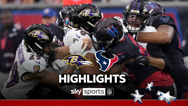 Houston Texans running back Joe Mixon, center, is tackled by Baltimore Ravens defenders during the first half of an NFL football game, Wednesday, Dec. 25, 2024, in Houston. 