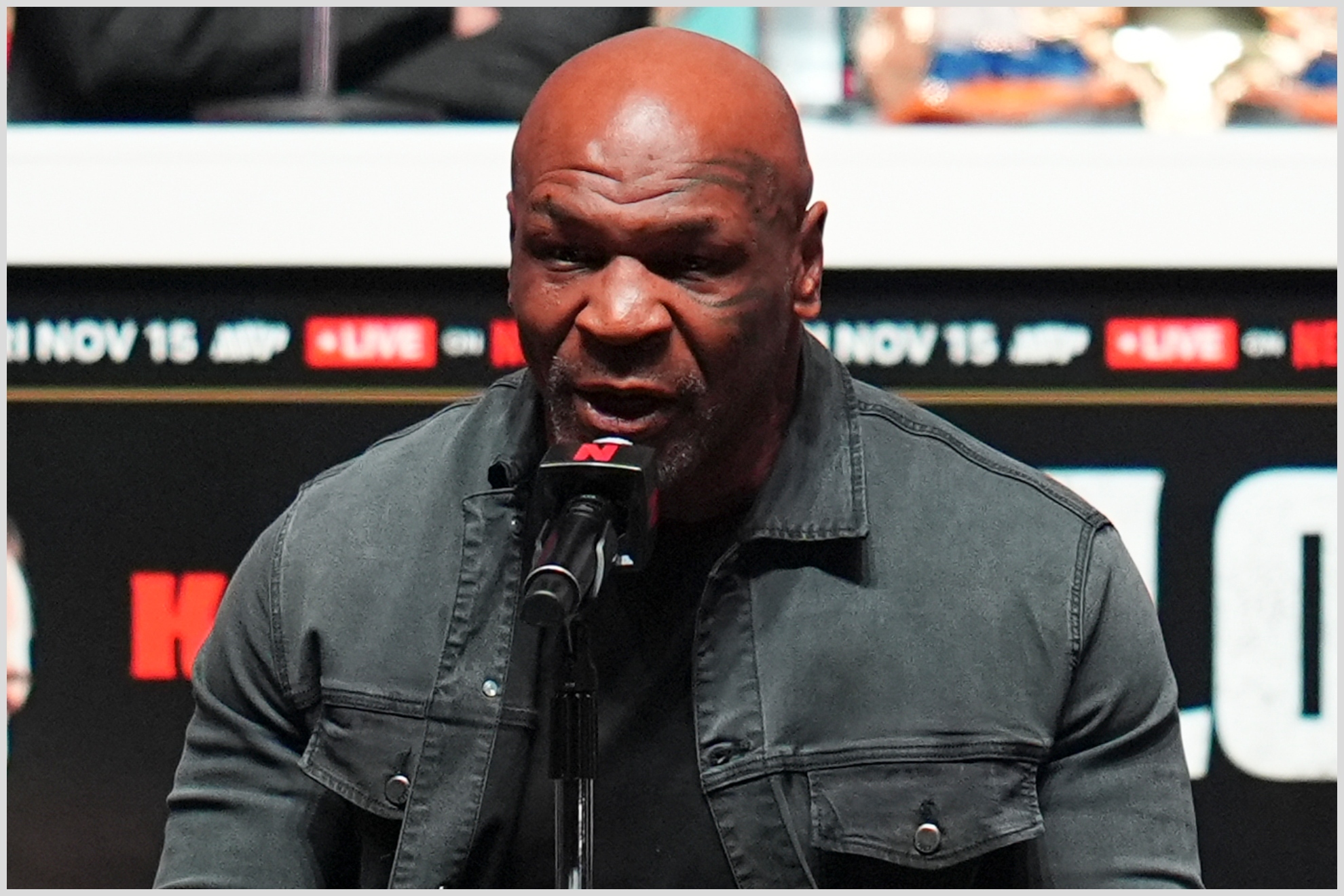 Mike Tyson speaks during a news conference ahead of his fight against Jake Paul