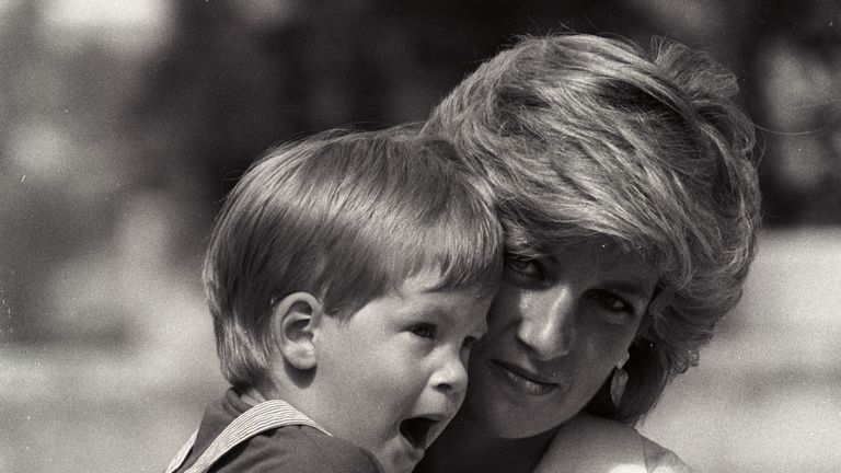 Aug 1988: Prince Harry yawns as his mother holds him during a morning picture session at Marivent Palace as guests of King Juan Carlos and Queen Sofia in Mallorca