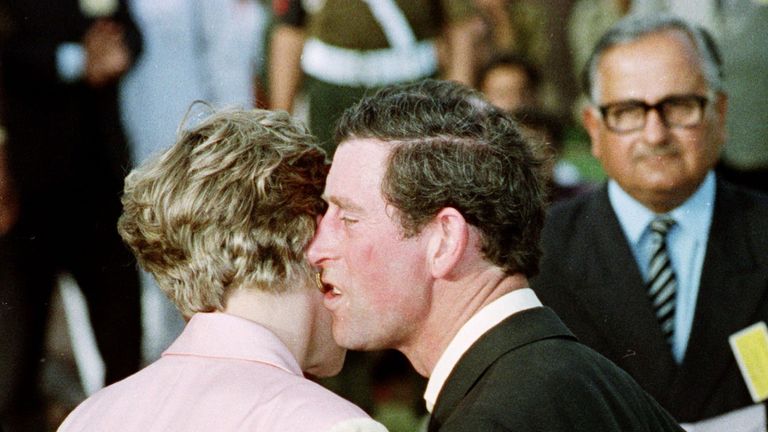 Feb 1992: Prince Charles kisses his wife Princess Diana after playing a game of polo with a local Rajasthan team in Jaipur, India