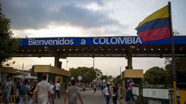 People cross the Simon Bolivar International Bridge on the border between Tachira in Venezuela and Cucuta in Colombia
