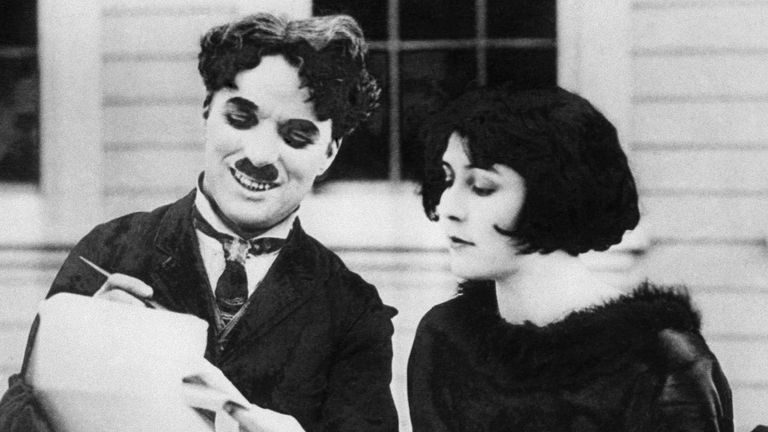 Charlie Chapin, in costume, sits with his leading lady Lita Grey in November 1924. Pic: AP

