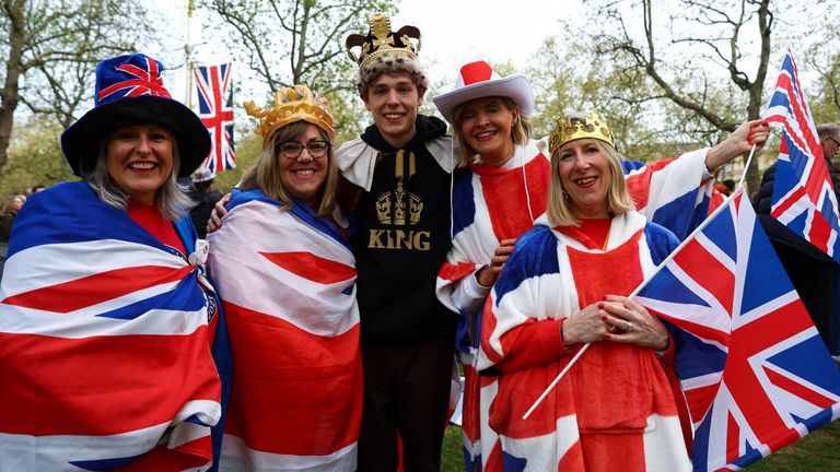 People wait to watch Britain's King Charles' procession to his coronation ceremony from Buckingham Palace to Westminster Abbey, at The Mall in London, Britain May 6, 2023. REUTERS/Paul Childs