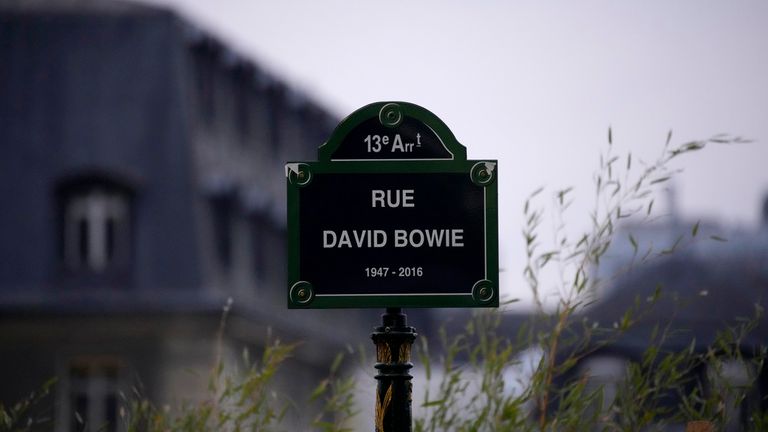 CORRECTS YEAR - The street sign of singer David Bowie is pictured after being unveiled during a ceremony in Paris, Monday, Jan. 8, 2024. The city of Paris is immortalizing late British music icon David Bowie by naming a street after him in the city's southeast on what would have been his 77th birthday on Monday. (AP Photo/Christophe Ena)