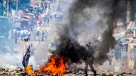 FILE - A barricade burns Tuesday, Nov. 5, 2024 in Mozambique's capital, Maputo,Tuesday, Nov. 5, 2024 in protests that have engulfed the country after the opposition rejected the results of the country's polls which saw the Frelimo party extend its 58-year rule. (AP Photo/Carlos Uqueio, File)