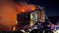 Firefighters work to extinguish a fire at a hotel in the ski resort of Kartalkaya in Bolu, Turkey.
Pic: Reuters