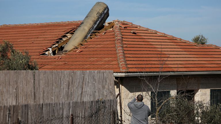 A man looks at a building damaged after a missile, launched from Yemen according to Israel's military, landed in Mevo Beitar, Israel.
Pic Reuters