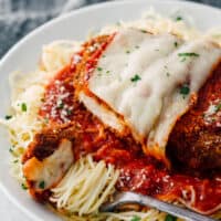 easy chicken parmesan over sauce and pasta