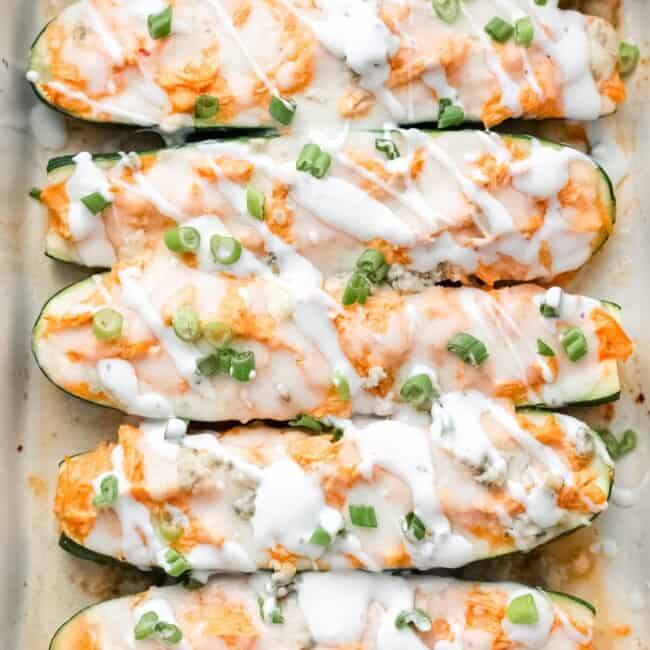 buffalo chicken zucchini boats in baking dish