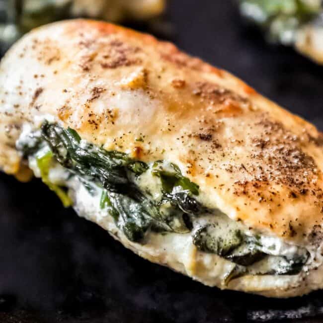 close up on chicken breast stuffed with spinach and cream cheese