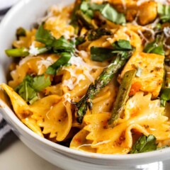 Close up overhead shot of sun-dried tomato pesto pasta in a bowl