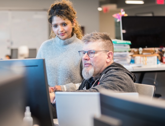 people looking at a computer screen