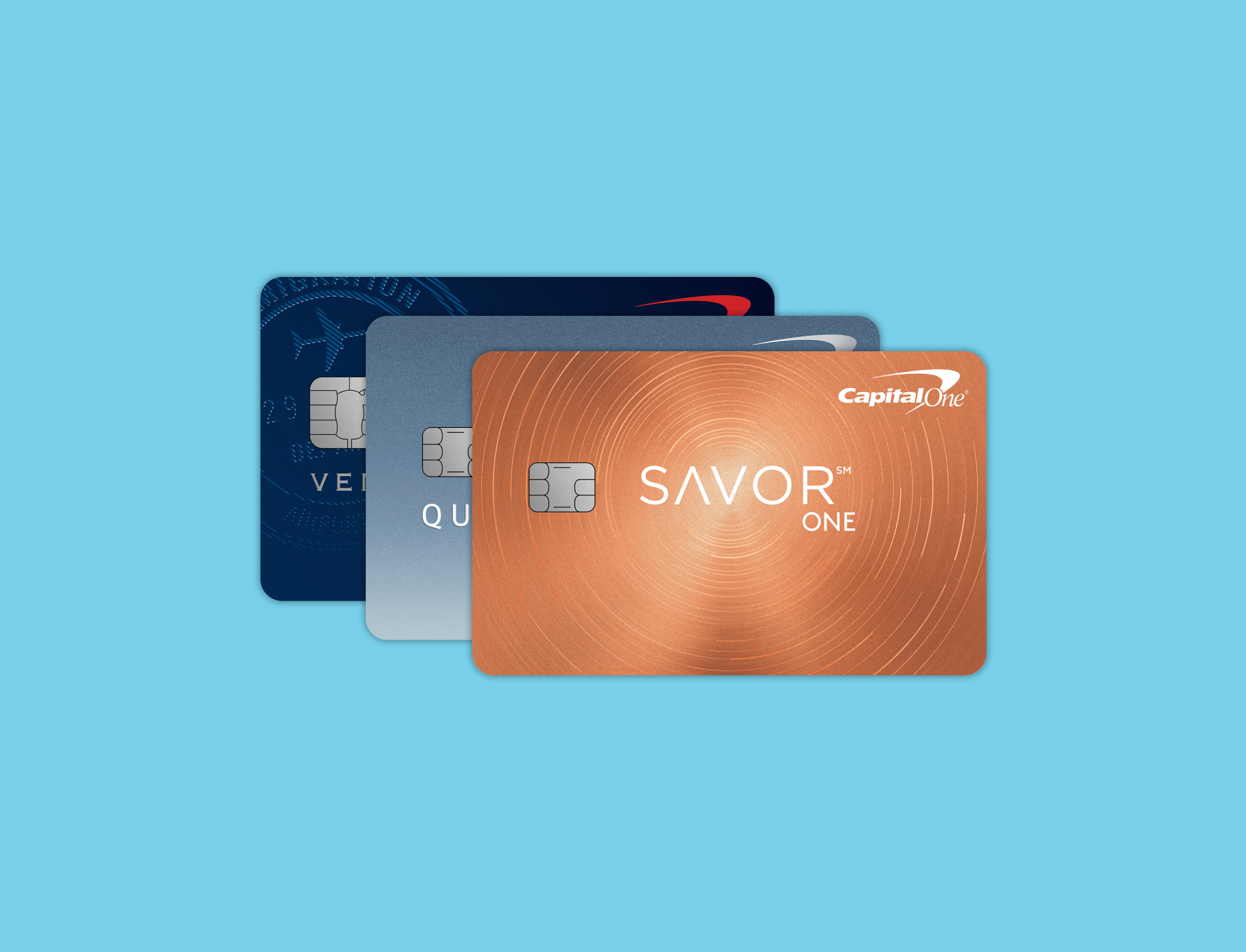 Capital One credit cards stacked on top of each other on a blue background