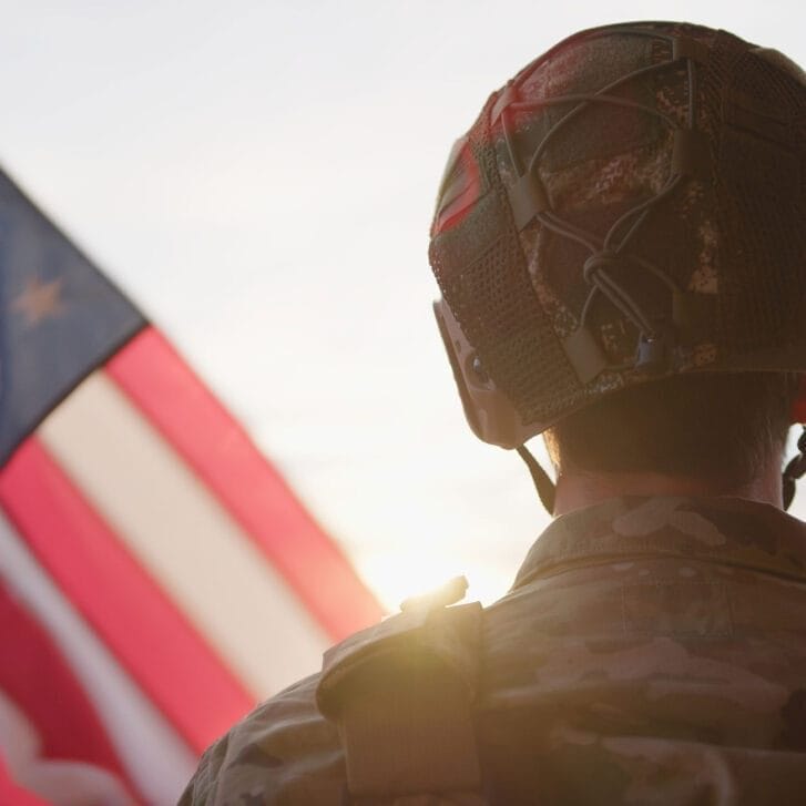 Back of soldier's head near the side of an American flag