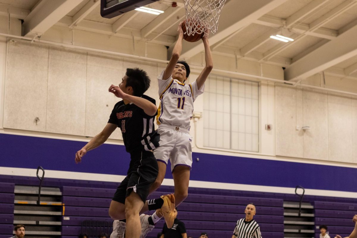 Junior and forward Ryan Shen attempts a layup during the second quarter. 