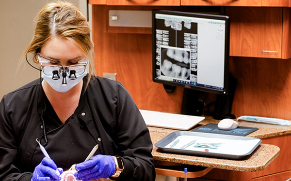 Taylor doing general and family dentistry on patient