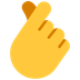 Cómo se ve el emoji Mano con dedo índice y pulgar cruzados en Microsoft.