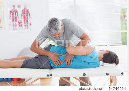 Stock Photo: Doctor examining man back