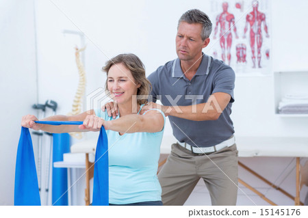 Stock Photo: Doctor examining his patient back