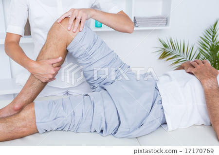 Stock Photo: Man having knee massage