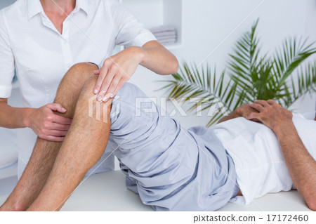 Stock Photo: Man having knee massage