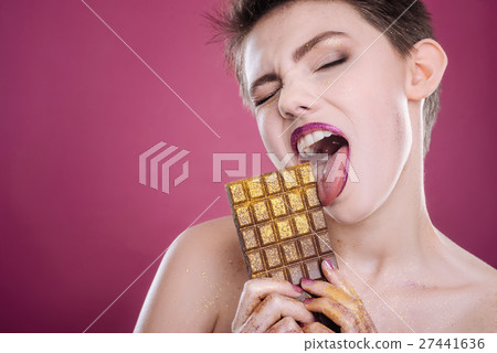 Nice young woman eating chocolate 27441636