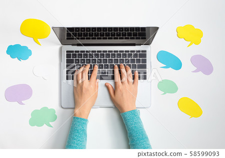 Social media concept with message bubbles and a laptop 58599093