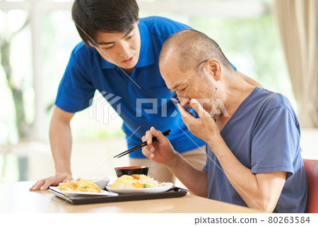 Elderly people coughing during meals 80263584