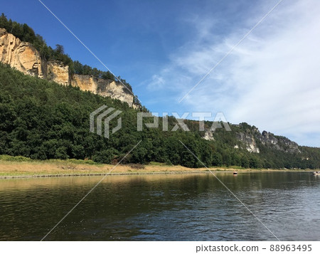 The golden rocky mountain of Saxon Switzerland seen from the ship of the river Elbe 88963495