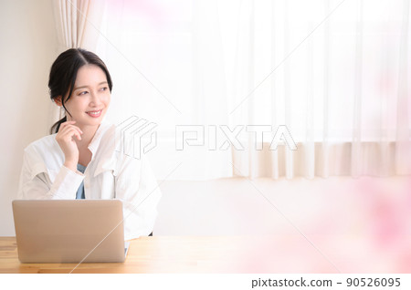 Beautiful woman working on a computer 90526095