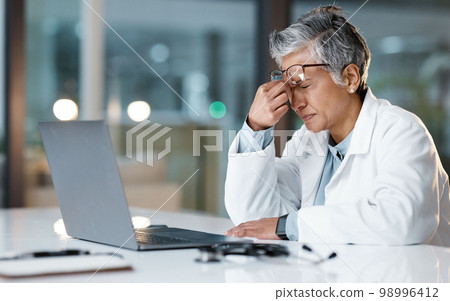 Night, stress and headache with face of doctor for medical, thinking and deadline review. Burnout, compliance and mental health with black woman for healthcare, medicine and science research 98996412