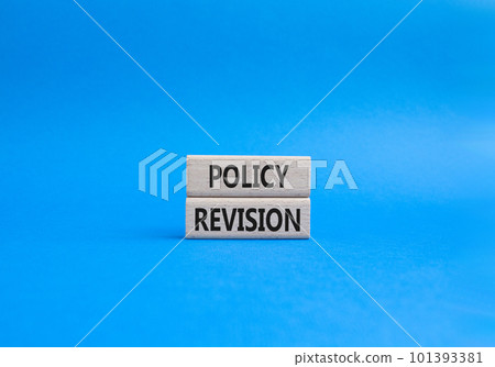 Policy revision symbol. Concept word Policy revision on wooden blocks. Beautiful blue background. Business and Policy revision concept. Copy space 101393381